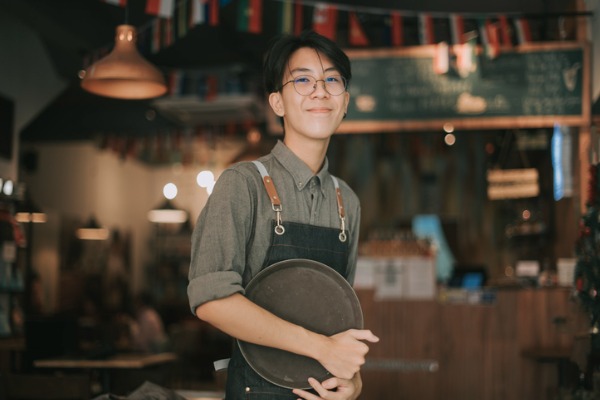 Young man smiling while working 